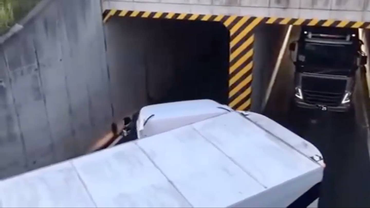 Watch This Huge Truck Neatly Tuck Into a Tiny Tunnel