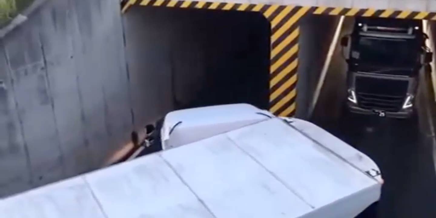Watch This Huge Truck Neatly Tuck Into a Tiny Tunnel