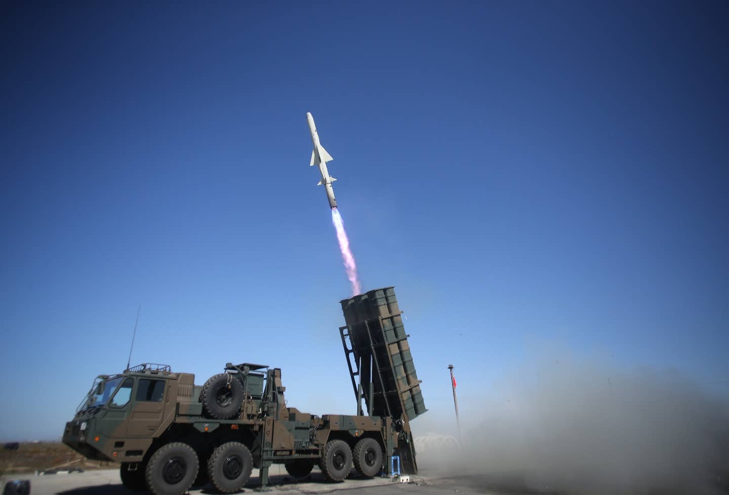 A Type 12 surface-to-surface missile firing from a ground launcher belonging to the Japan Ground Self-Defense Force. <em>JGSDF</em>