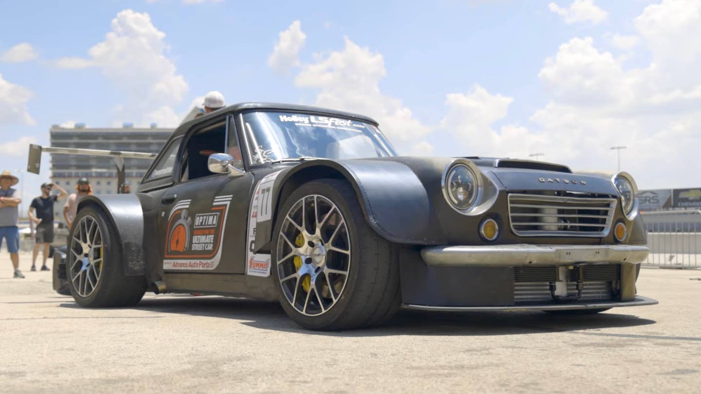 "Dirty Datsun" 2000 with widened fenders and a large wing
