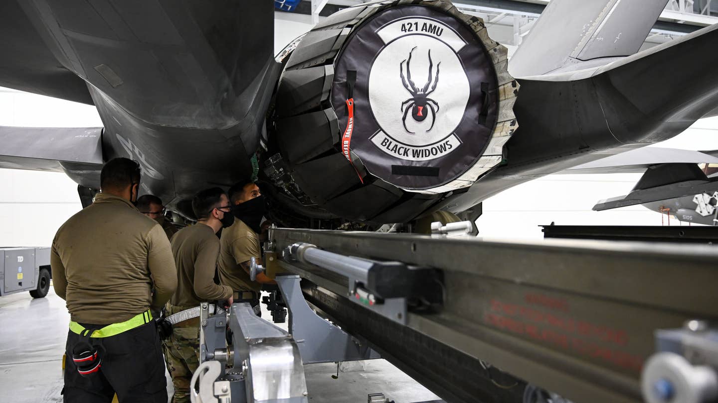 Maintainers with the 421st Fighter Generation Squadron prepare to remove an engine from an F-35A Lightning II at Hill Air Force Base, Utah, Feb. 25, 2021. (U.S. Air Force photo by R. Nial Bradshaw)