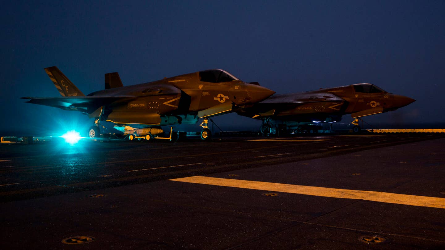 U.S. Marines with Marine Fighter Attack Squadron 211, 13th Marine Expeditionary Unit, stage ordnance before loading it into an F-35B Lightning II aboard the <em>Wasp</em>-class amphibious assault ship<em> USS Essex</em> in preparation for the F-35B's first combat strike, Sept. 27, 2018. (Photo by Cpl. A. J. Van Fredenberg/U.S. Marine Corps via Getty Images)