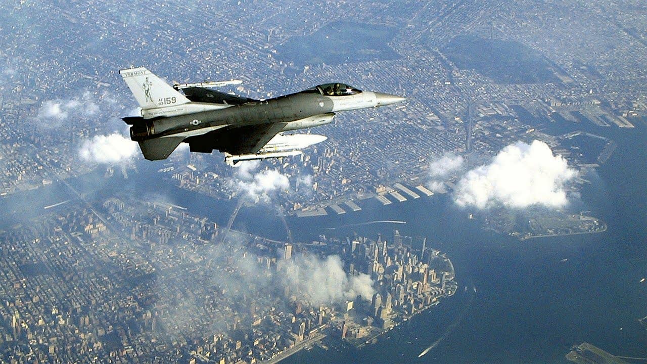 An iconic image of a 134th FS F-16C patrolling the skies over the smoldering ruins of the World Trade Center on September 12th. (U.S. Air Force photo)