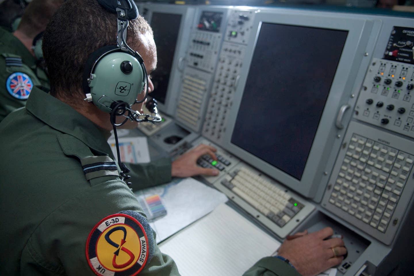 An E-3D controller at work. On September 11th Simon’s crew used the onboard radar to provide a detailed picture of commercial air traffic over the Atlantic and when required, vectored fighters to suspect aircraft. (Crown Copyright/SAC Andy Stevens)