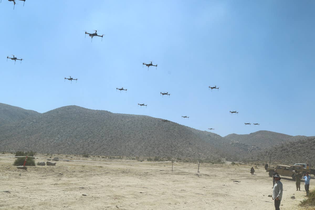 Elements of a 40-drone swarm provided via the Threat Systems Management Office take off at the NTC in support of the 11th Armored Cavalry Regiment during an exercise on May 8, 2019. <em>US Army / Pv2 James Newsome</em>