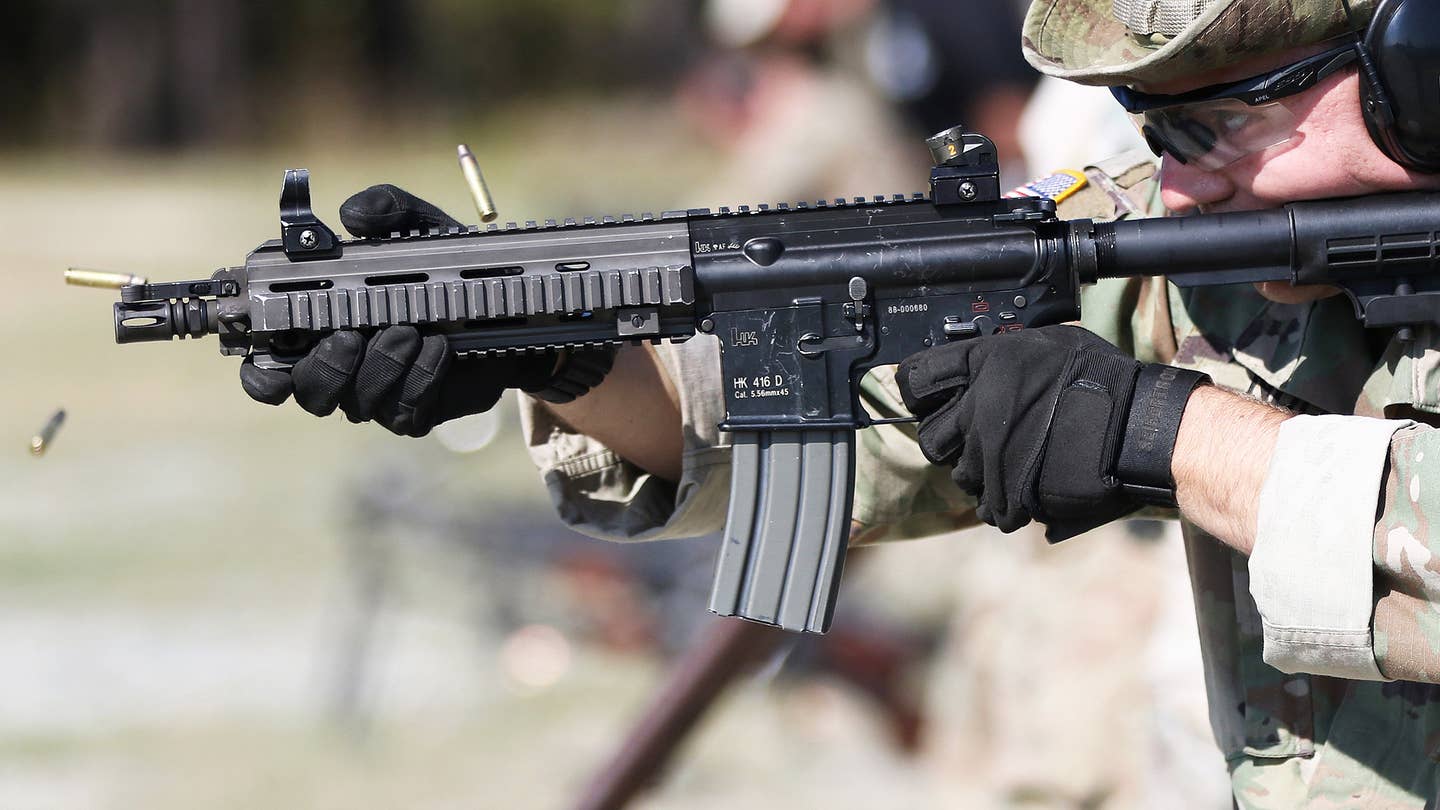A student assigned to the U. S. Army's John F. Kennedy Special Warfare Center and School fired an older short-barrel HK 416D during training in 2019. US Army / K. Kassens)