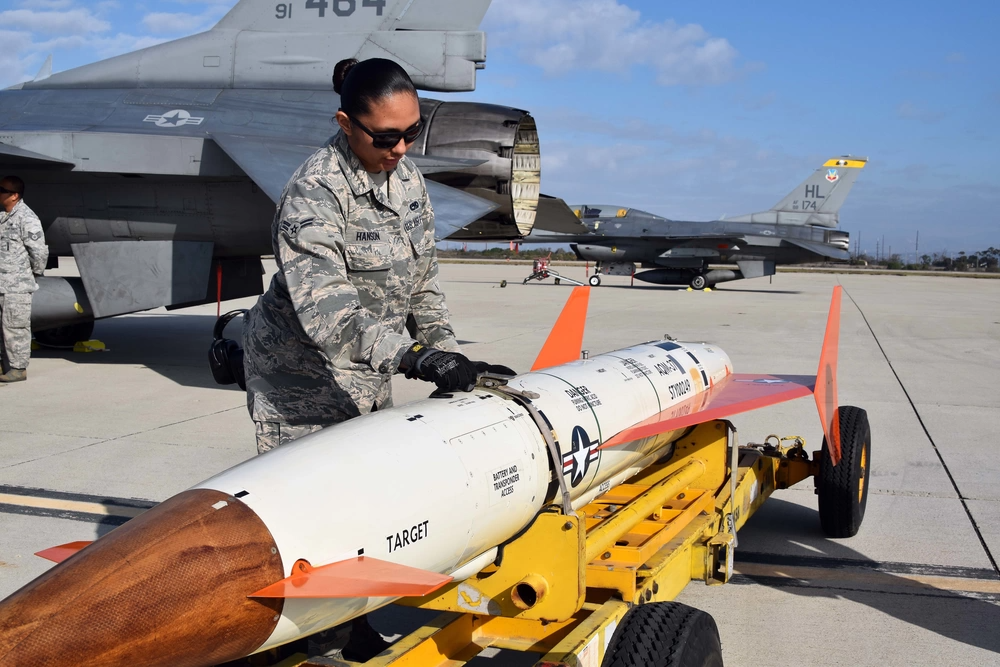 Airman 1st Class Cierra-Mae Hanson, 412th Maintenance Group, inspects an AQM-37D supersonic target before it is loaded on to an Edwards Air Force Base F-16 at Naval Air Station Point Mugu, California, Nov. 28, 2018.<em> Credit: U.S. Navy photo by BU3 Dakota Fink</em>