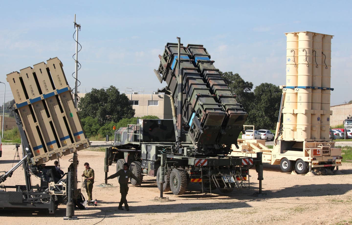An Israeli Iron Dome air defense system (left), a MIM-104 Patriot surface-to-air missile launcher (center), and an Arrow 3 anti-ballistic missile launcher during Exercise Juniper Cobra at Hatzor Israeli Air Force Base in 2016. <em>GIL COHEN-MAGEN/AFP via Getty Images</em>