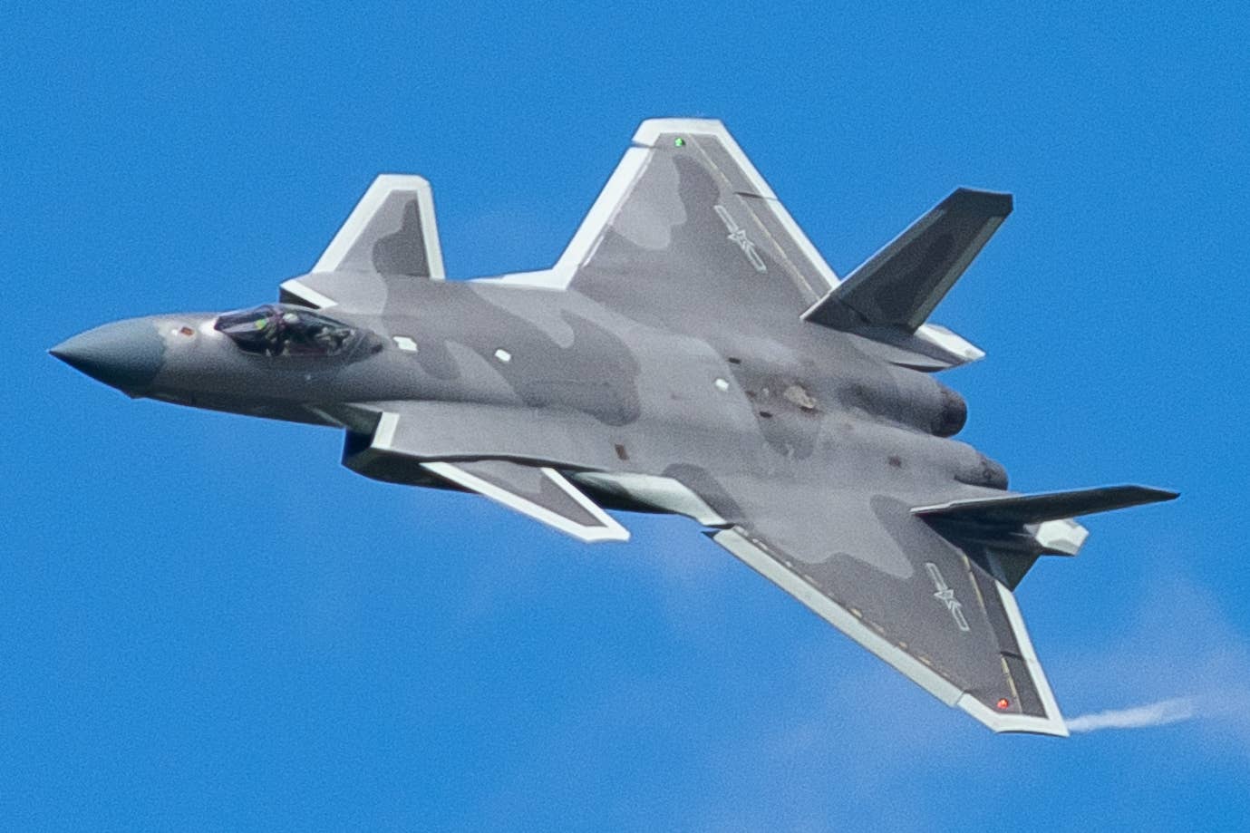 A PLAAF J-20 performs during an airshow display. <em>N509FZ/Wikimedia Commons</em>