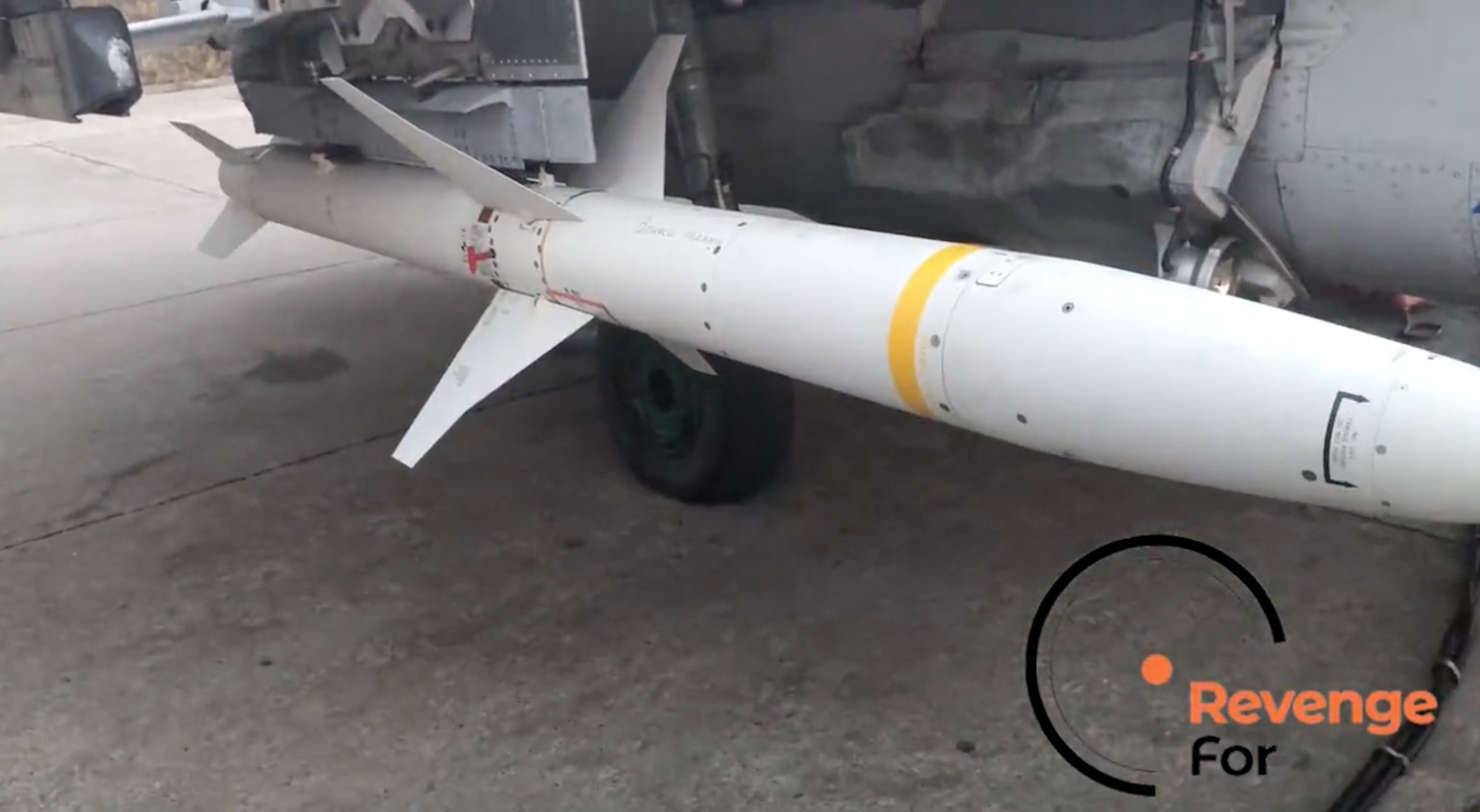 Screenshot from the RevengeFor video showing the AGM-88 fitted to the MiG-29's inner weapons station via a special pylon that the HARM's LAU-118 adapter pylon is attached to. <em>Credit: RevengeFor via Twitter</em>