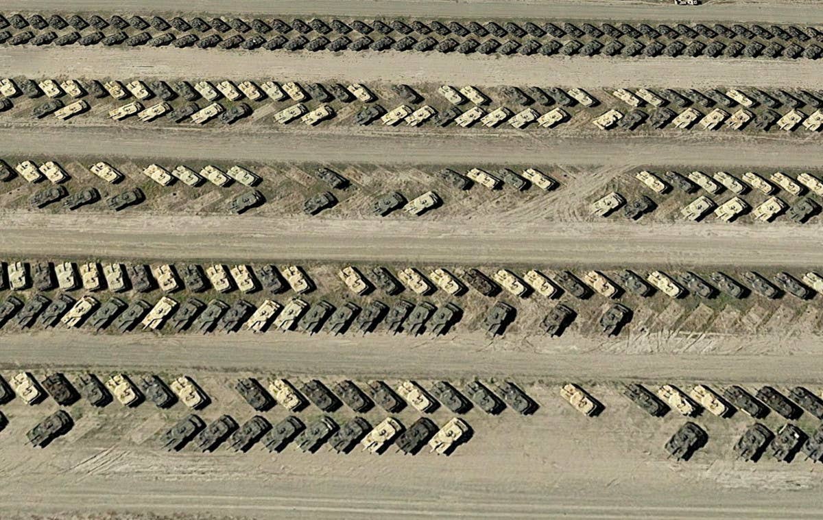 A satellite image showing rows of M1 Abrams tanks and other armored vehicles at Sierra Army Depot in California. <em>Google Earth</em>