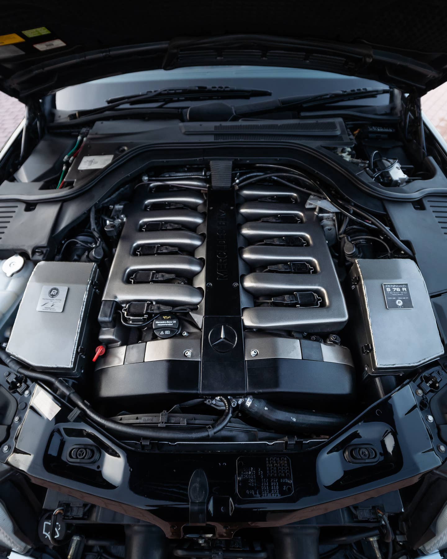 Mercedes had perfected engine bay looks by the early 1990s. Plastic covers and trim have only taken us backward since then. <em>Renntech</em>