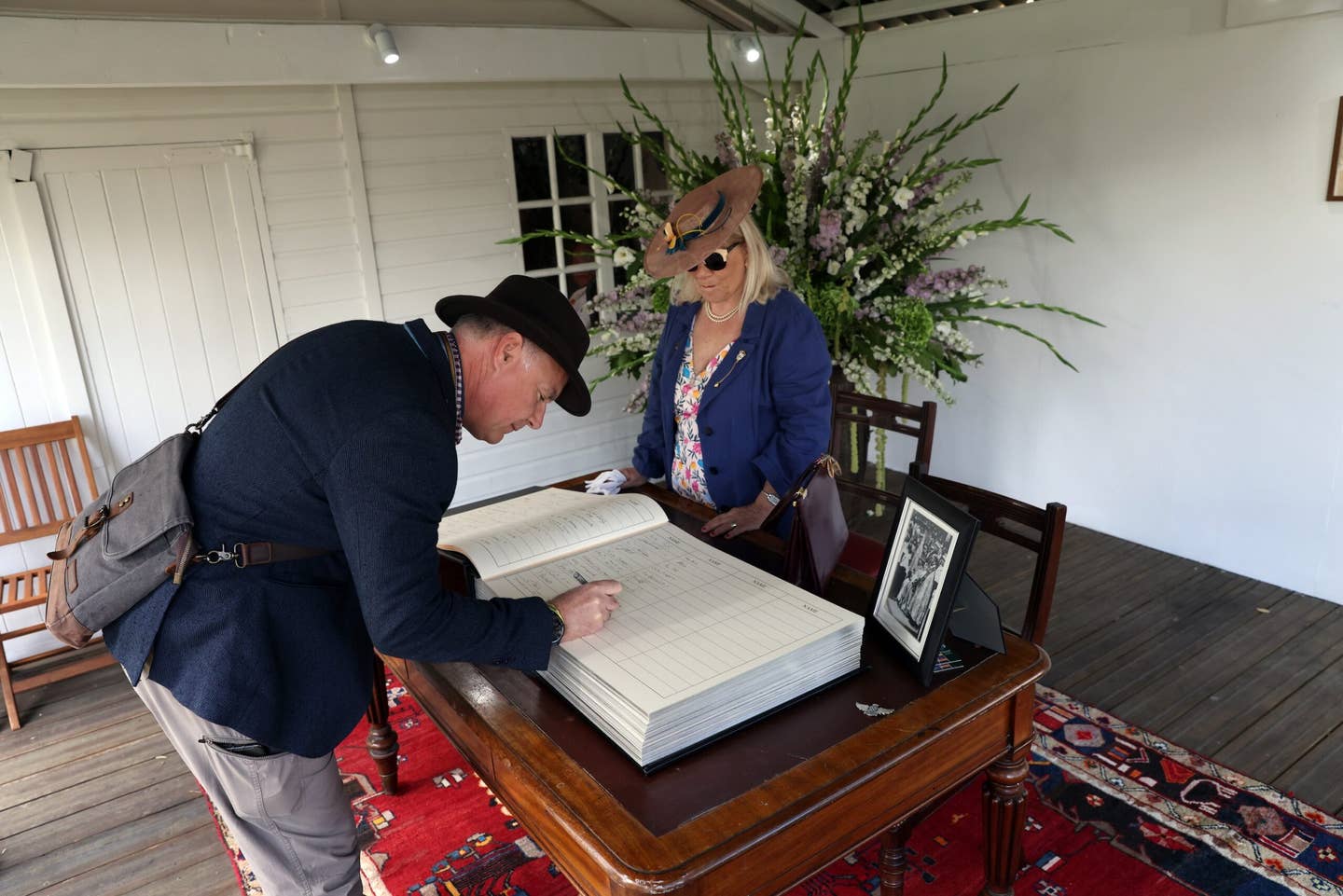 The book of condolences for Queen Elizabeth II is signed during the Goodwood Revival 2022 at Goodwood Motor Circuit in West Sussex. <em>Matt Alexander/PA Wire</em>