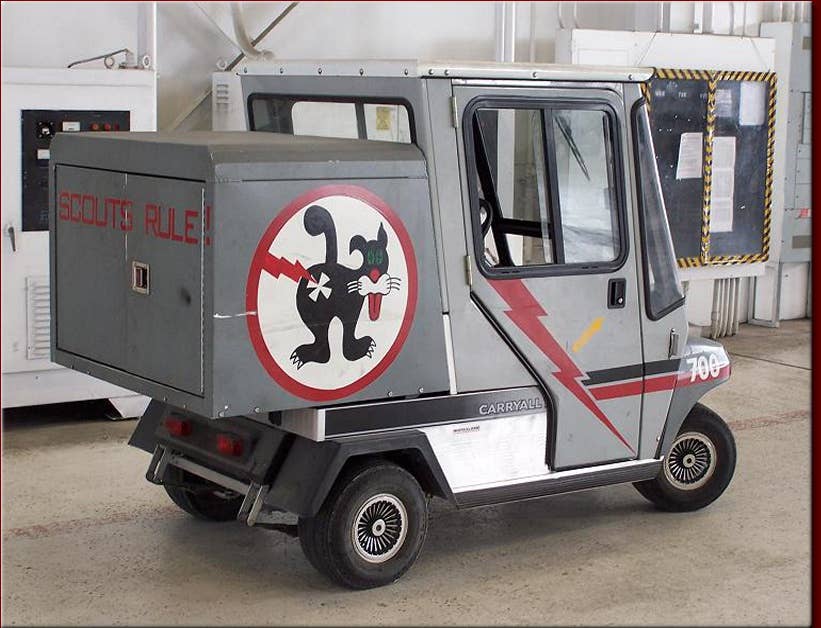 The Duty Cat on its final ride — a Carryall golf cart. <em>Gil Gregg</em>