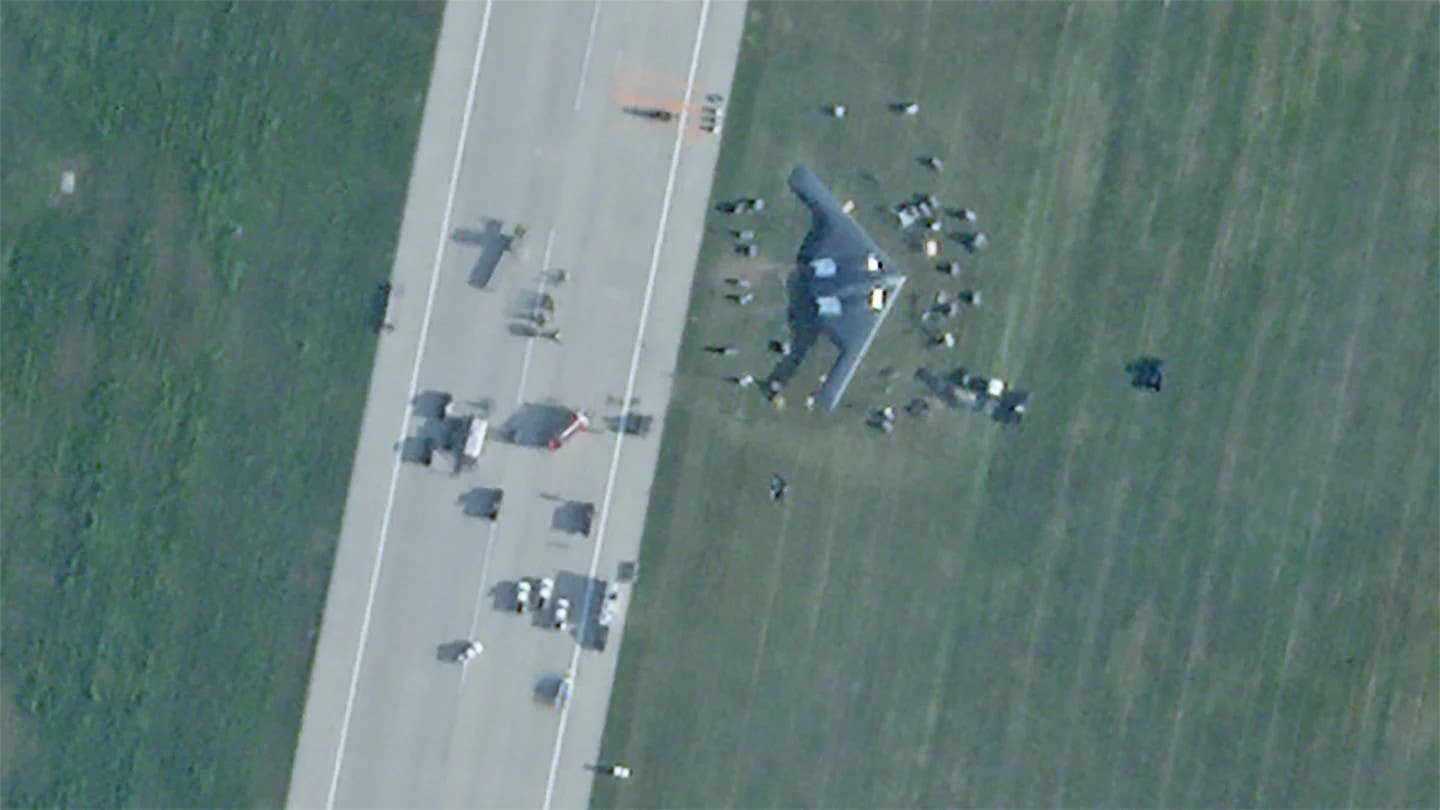 A satellite image showing the Spirit of Georgia resting with its wing down off the runway at Whiteman Air Force Base on September 14, 2021. <em>PHOTO © 2021 PLANET LABS INC. ALL RIGHTS RESERVED. REPRINTED BY PERMISSION</em>