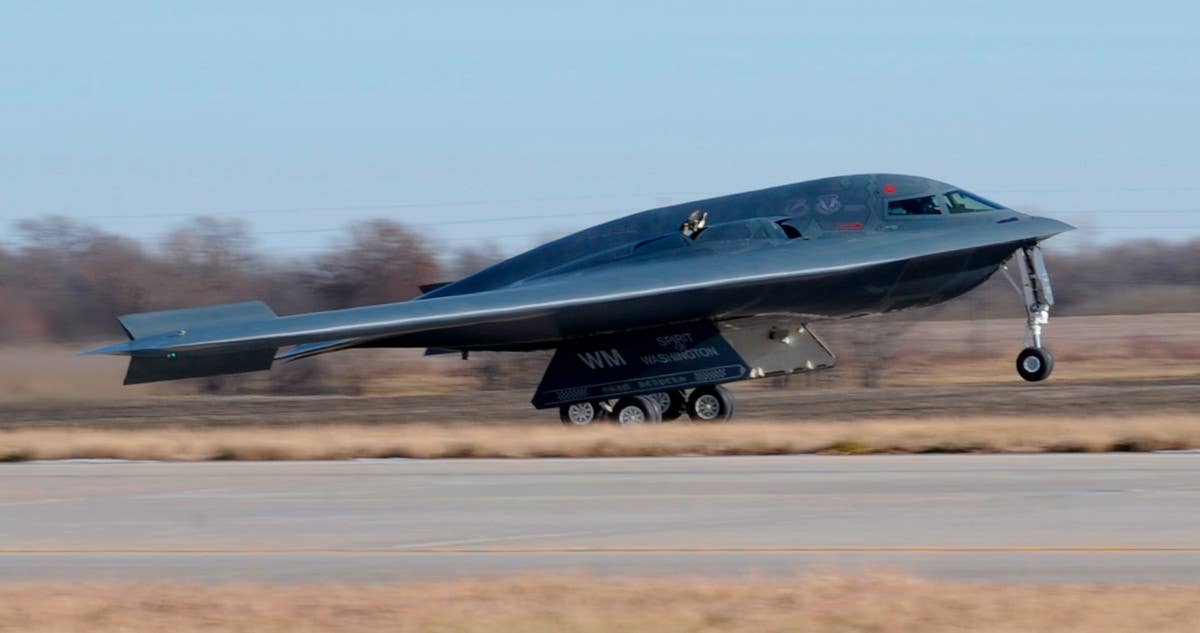 B-2, serial number 88-0332, also known as the Spirit of Washington,  lands at Whiteman Air Force Base in December 2013. <em>USAF</em>
