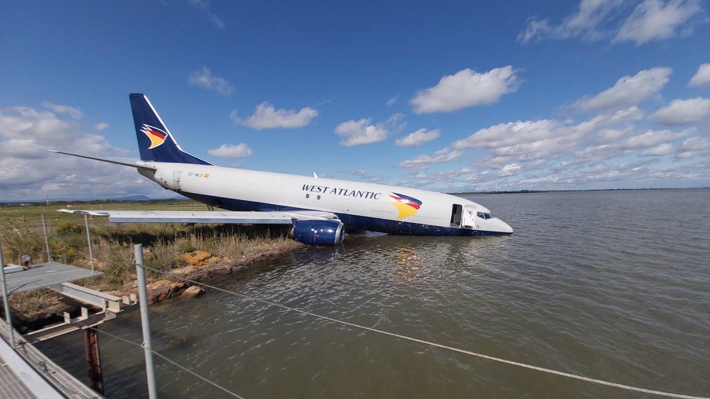 Boeing 737 cargo jet overshoots runway and lands in lake
