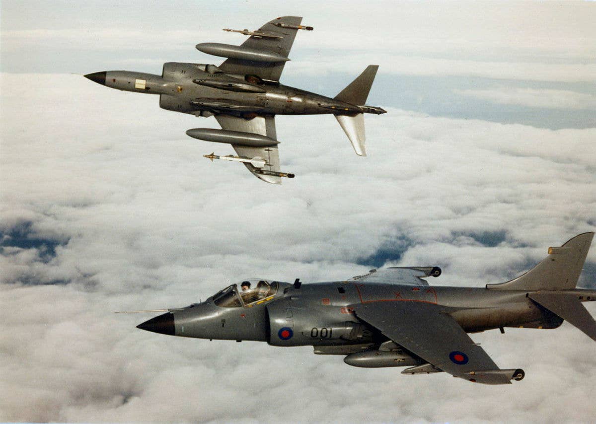A pair of U.K. Royal Navy Sea Harrier FRS1s off the coast of the Falkland Islands soon after the conflict. Sea Harriers claimed 23 enemy aircraft shot down during the Falklands War; two of their own kind were lost to enemy ground fire. <em>Crown Copyright</em>
