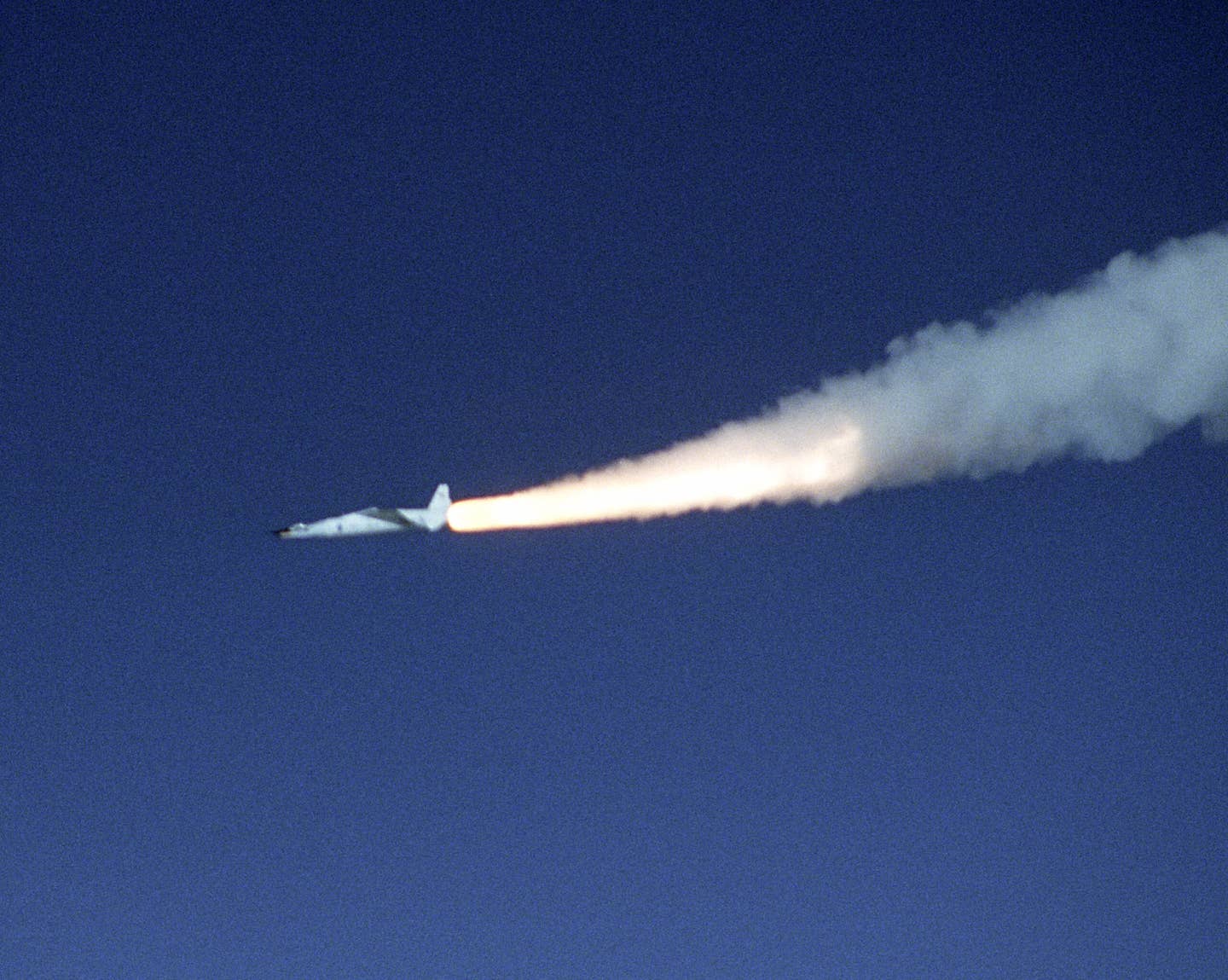 An X-43A hypersonic research aircraft and its modified Pegasus booster rocket accelerate after launch from NASA's B-52B launch aircraft over the Pacific Ocean. <em>Credit: NASA photo by Carla Thomas</em>