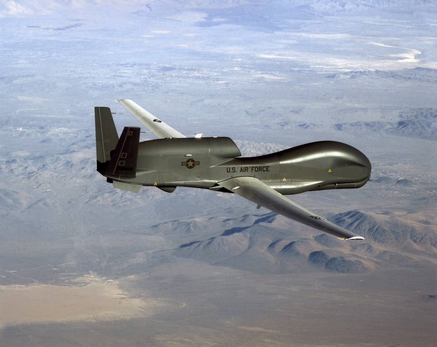 An RQ-4 Global Hawk soars through the sky to record intelligence, surveillance, and reconnaissance data. <em>Credit: U.S. Air Force</em>