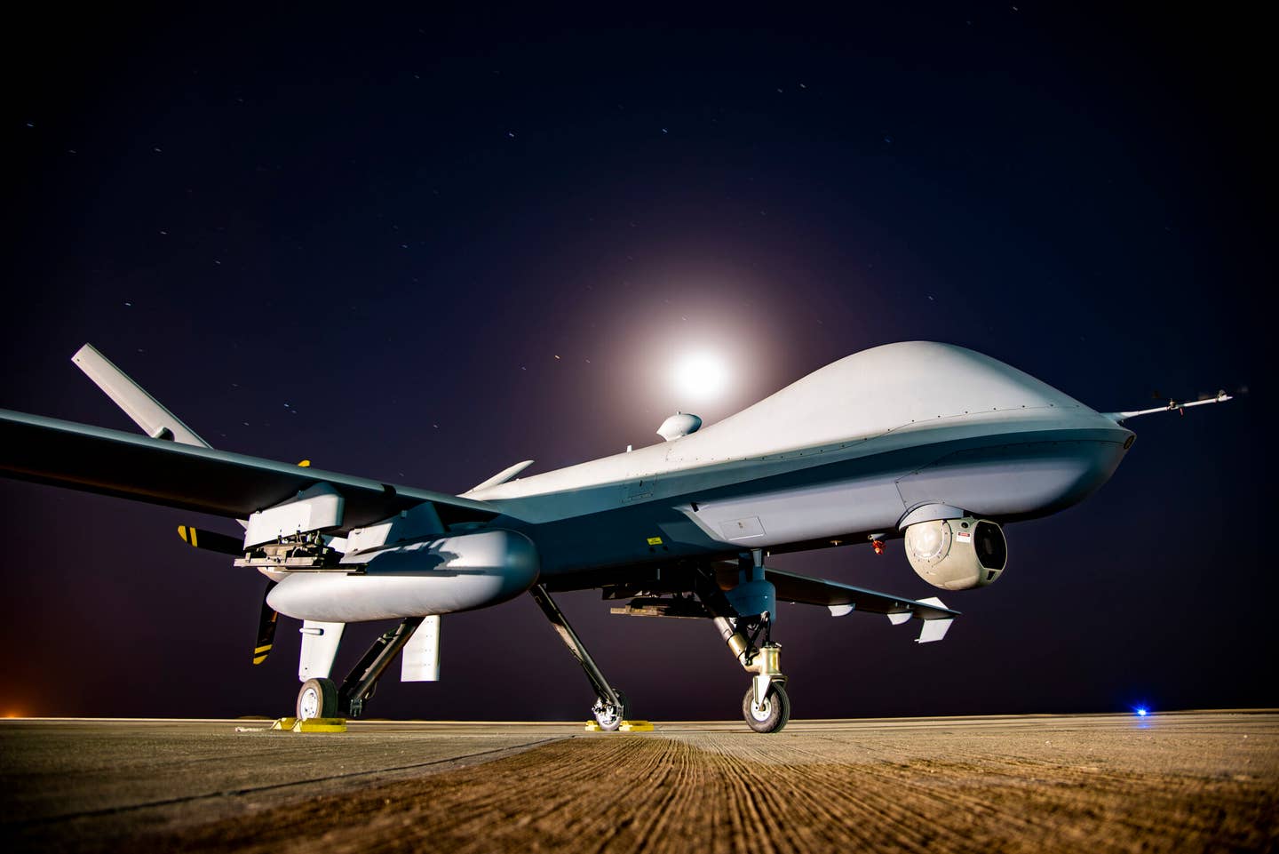 An MQ-9 Reaper sits on the 361 Expeditionary Attack Squadron flightline at an undisclosed location, Aug. 6, 2022. <em>Credit: U.S. Air Force photo by Tech. Sgt. Jim Bentley</em>