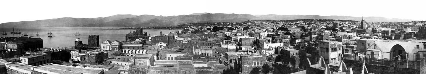 Beirut in the 19th-century, with a view of the harbor, surrounding peninsula, and the mountains in the distance. <em>Maison&nbsp;Bonfils/Wikimedia Commons.</em>