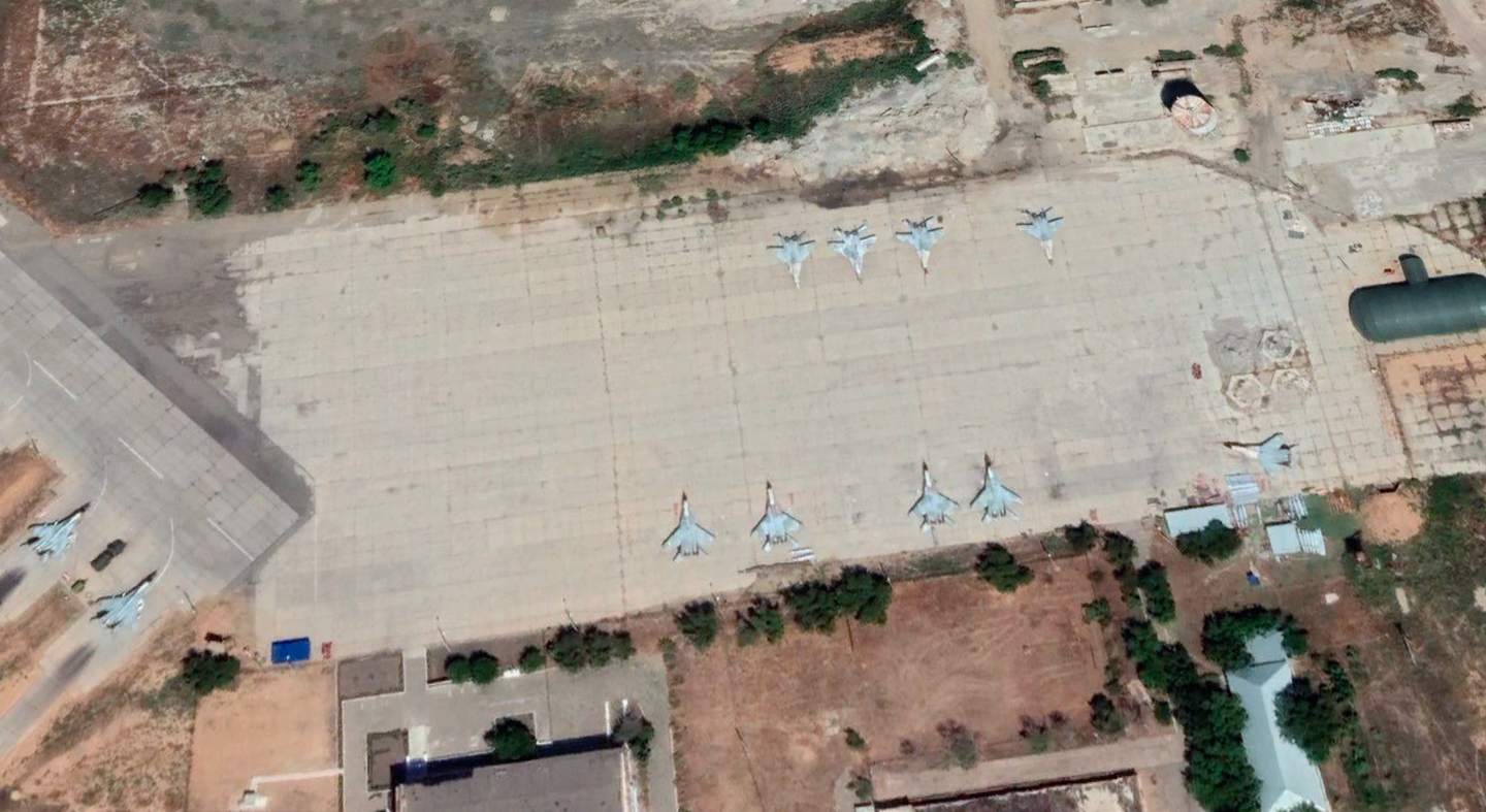 A close-up of the same image showing 11 MiG-29s on the eastern side of the base. The two armed jets on the left appear to be part of a quick reaction alert unit. <em>Google Earth</em>