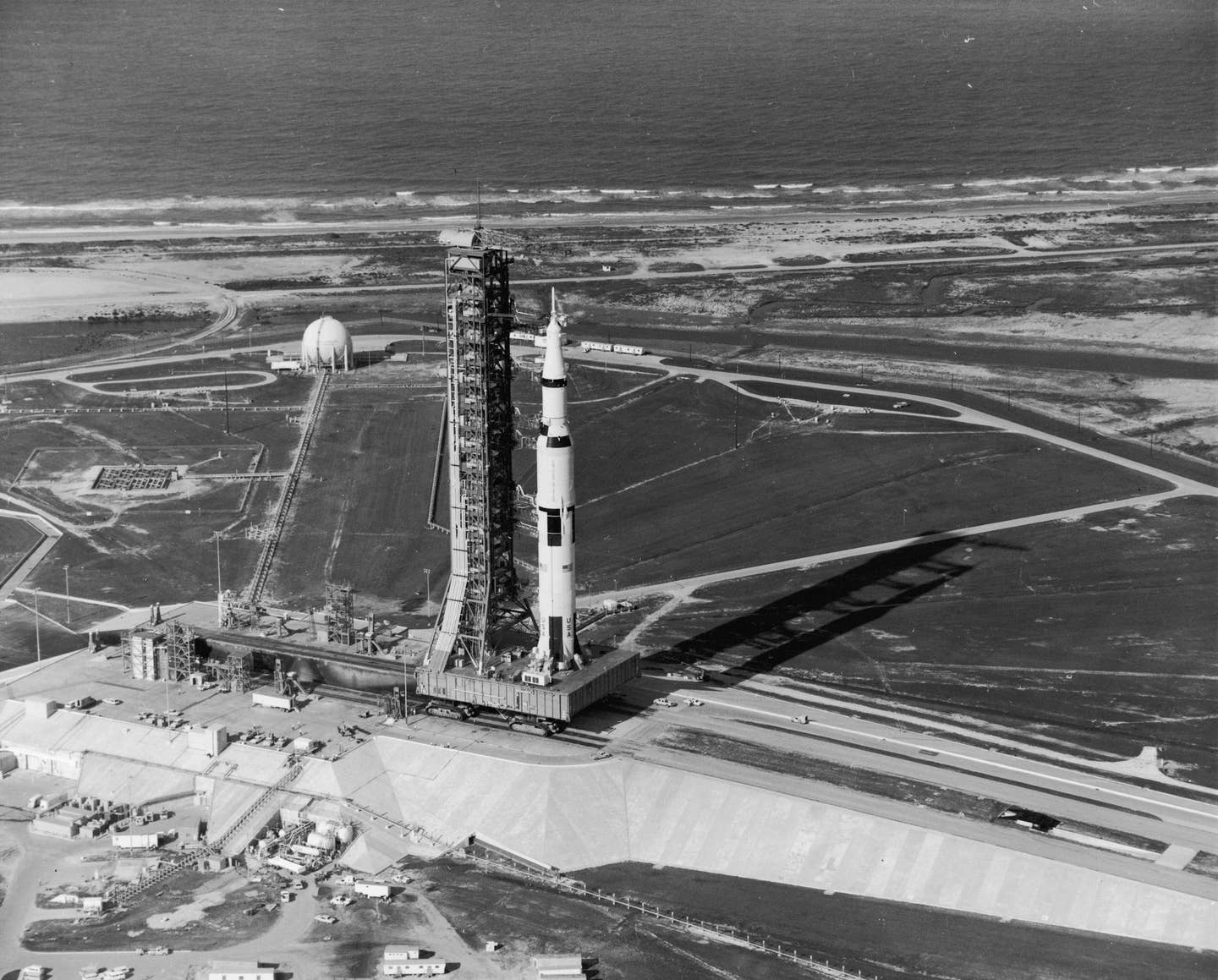 View of the Apollo 11 rocket standing with its gantry on the launch pad at Kennedy Space Center, Cape Canaveral, Florida, July 16, 1969. The rocket served in the first American manned lunar mission, with Neil Armstrong, Michael Collins, and Edwin Aldrin. <em>Photo by Hulton Archive/Getty Images.</em>