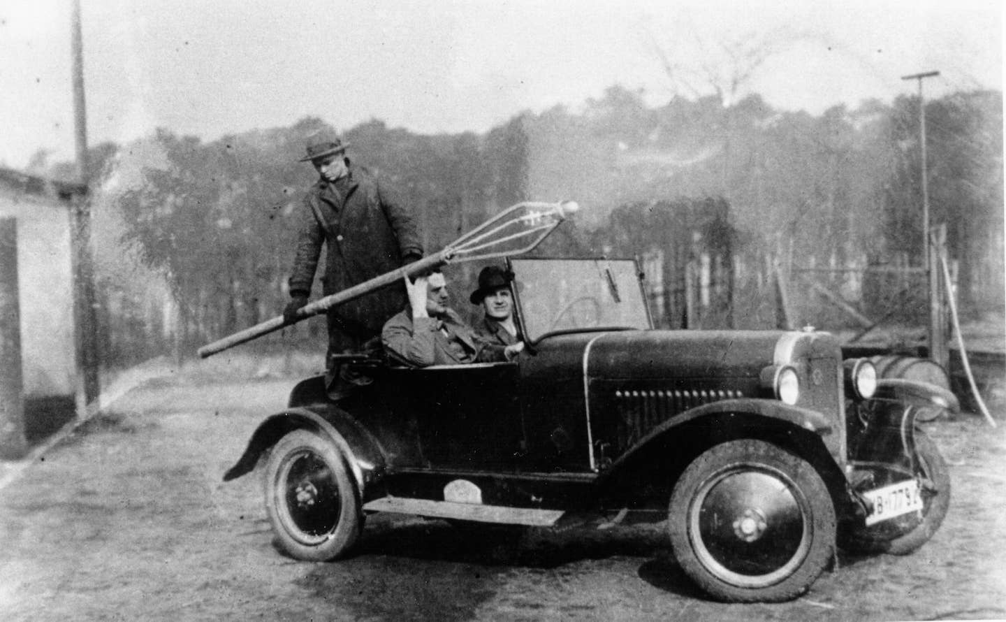 Wernher von Braun (in the driver’s seat) and two colleagues, conducting early rocket experiments in 1931. <em>Unknown author/Wikimedia Commons.</em>