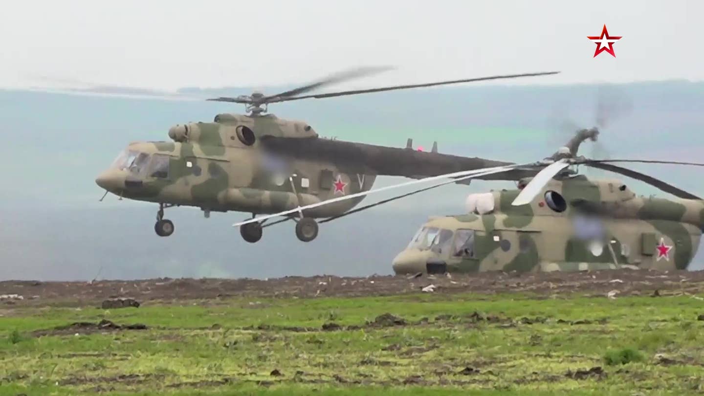 A pair of Mi-8MTPR-1 helicopters in the early spring of this year. The letter ‘V’ indicates they are from the Eastern Military District. <em>TV Zvezda</em>