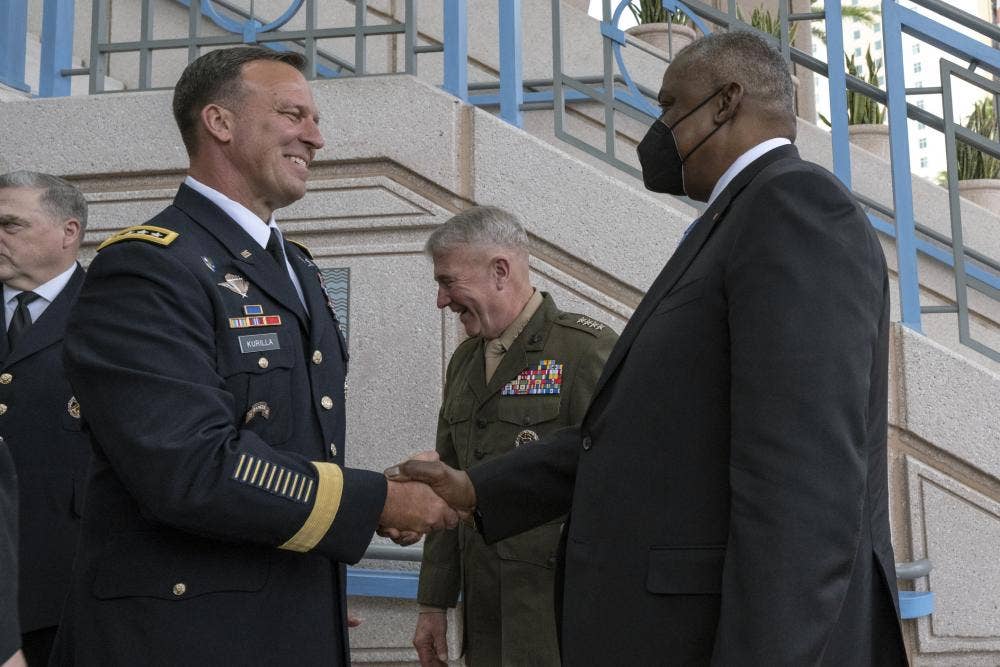 Secretary of Defense Lloyd J. Austin III (right) greets U.S. Central Command leader, Army Gen. Michael “Erik” Kurilla. (DoD photo by Lisa Ferdinando)