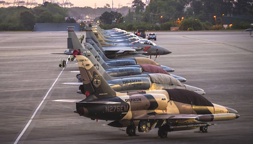 Draken International L-159E Honey Badger aggressor jets, in the foreground, share the flight line with Air National Guard F-15 and F-16 fighter jets during Exercise Sentry Savannah 2021. <em>U.S. ANG / Tech Sgt. Nicole Manzanares</em>