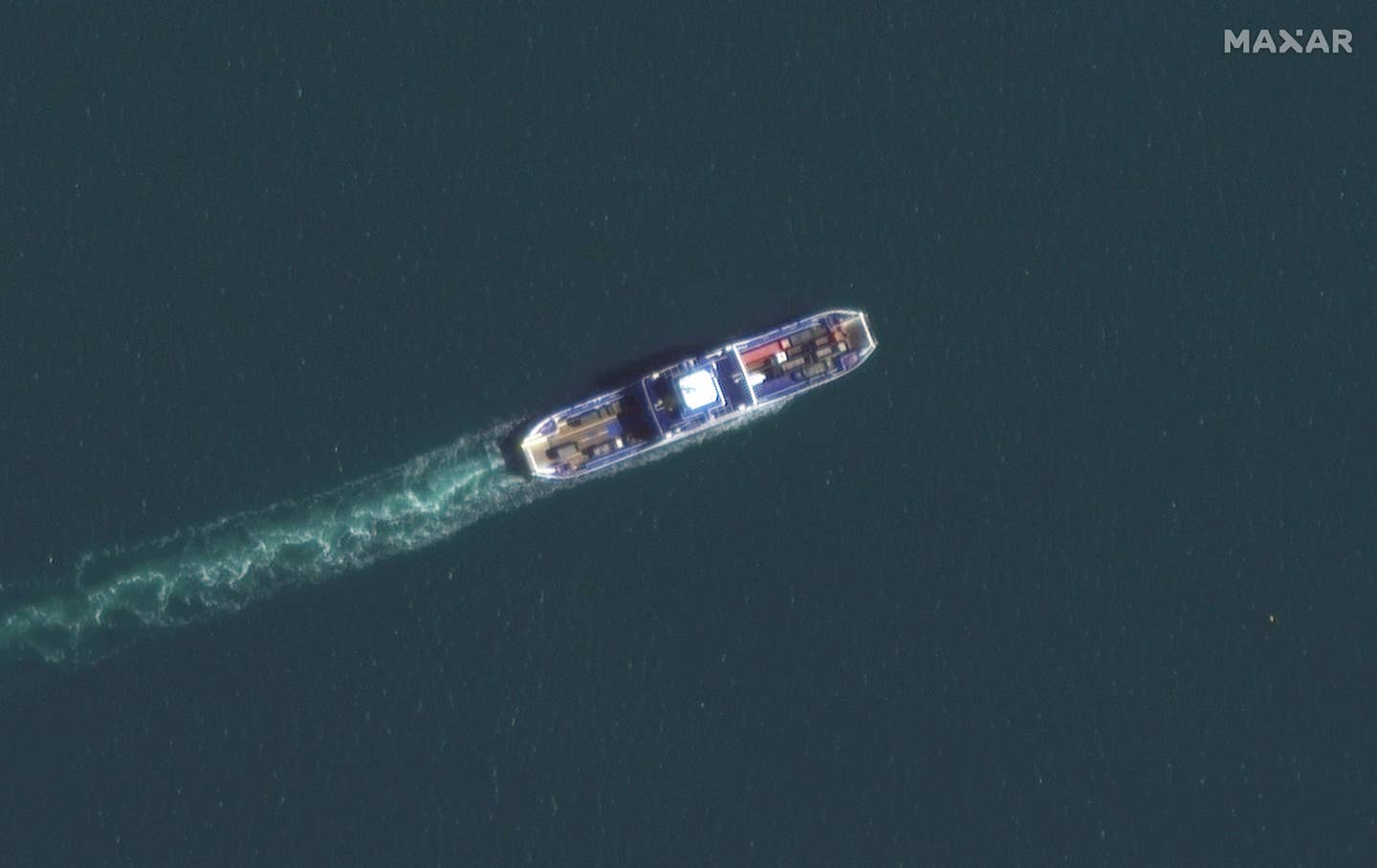 A ferry carrying trucks across the Kerch Strait. (Satellite image ©2022 Maxar Technologies).