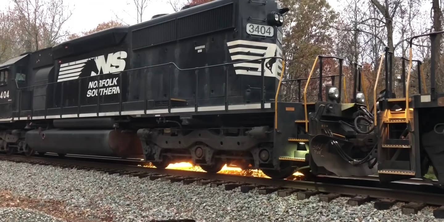 Norfolk Southern locomotive sprays sparks from its wheels