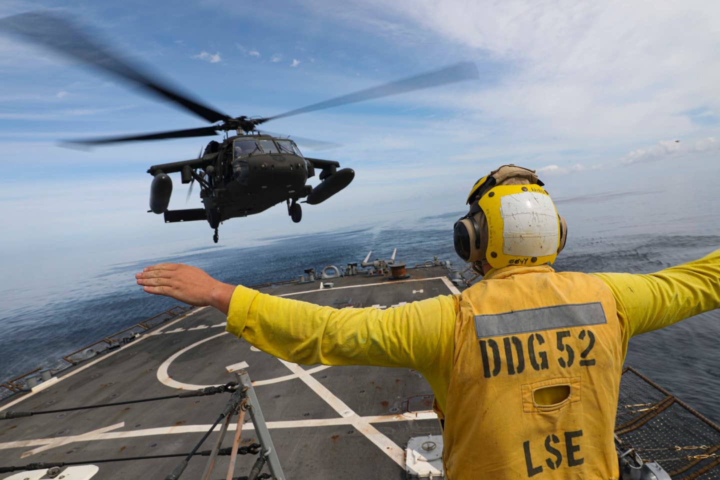 The Army already is flying its Black Hawks to and from Navy ships, here off Arleigh Burke-class guided-missile destroyer USS Barry near Korea. <em>U.S. Navy photo by Mass Communication Specialist 1st Class Greg Johnson</em>