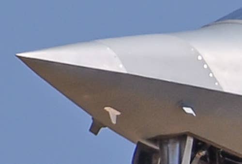 A close-up view of N401XP's nose showing two new antennas, to the right and left, as well as a small white one that had been seen fitted previously. <em>@Task_Force23</em>