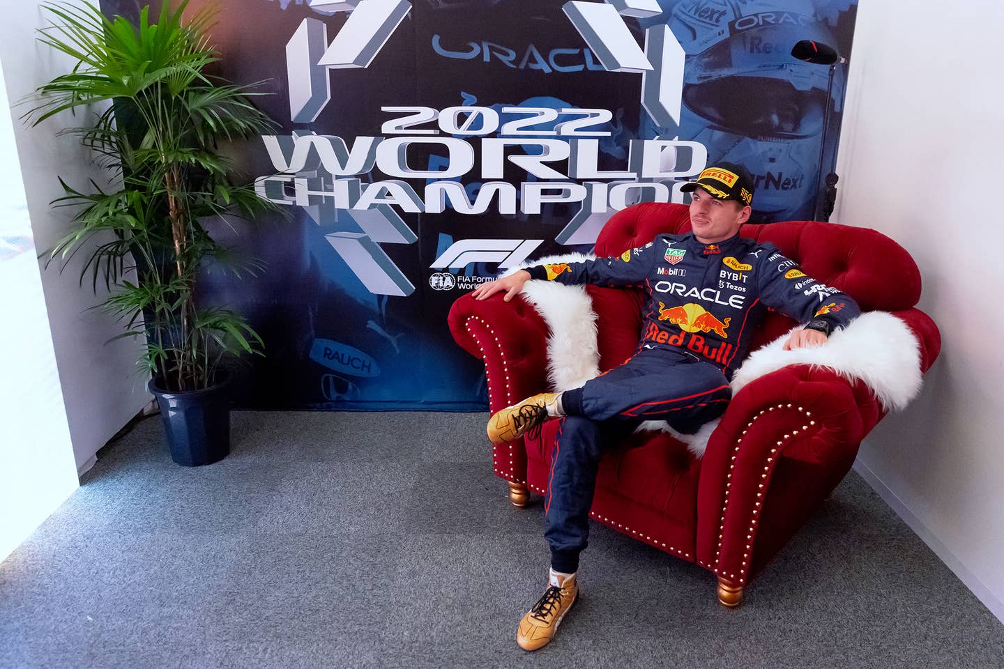 Race winner and 2022 F1 World Drivers Champion Max Verstappen of Netherlands and Oracle Red Bull Racing sits in the World Champion's cool-down room after the F1 Grand Prix of Japan at Suzuka International Racing Course on Oct. 9, 2022, in Suzuka, Japan. <em>Dan Istitene/Getty Images</em>