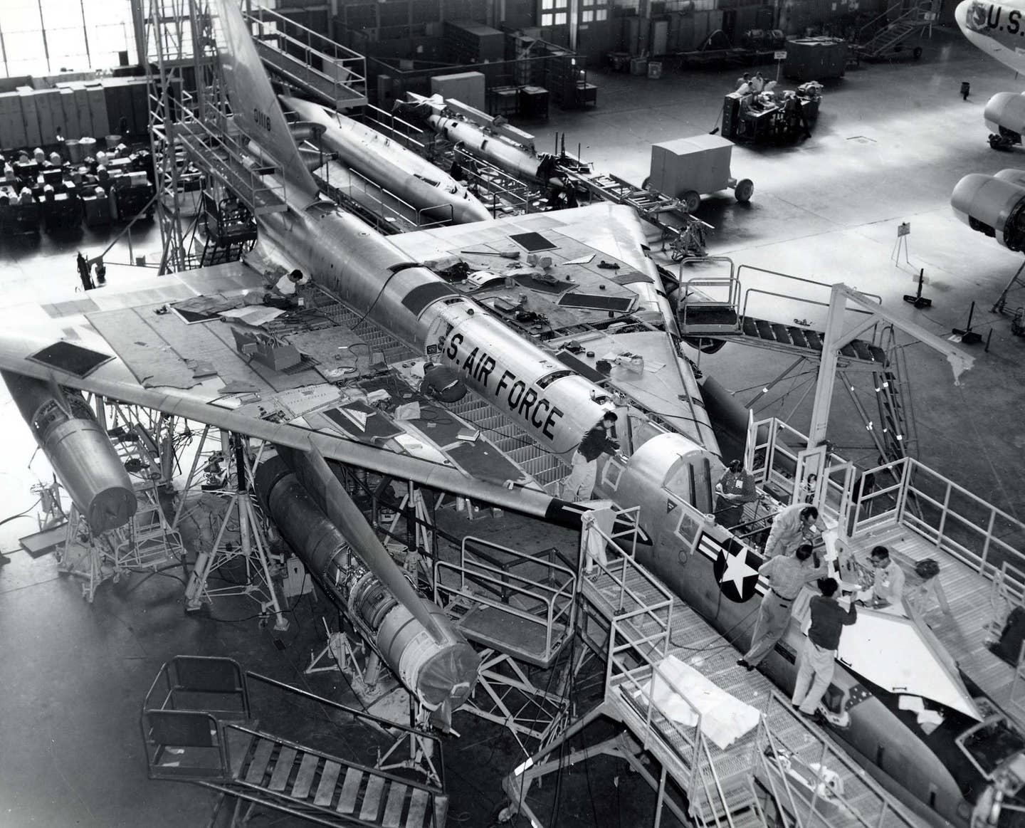 B-58A Hustler 60-1116 in final assembly. The two-part mission pod is seen behind the bomber, on the right. <em>U.S. Air Force</em>