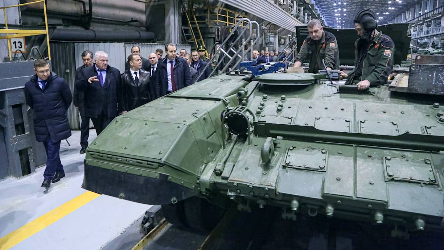 Russia’s Medvedev Threatens Defense Industry Arrests During Tank Plant Visit