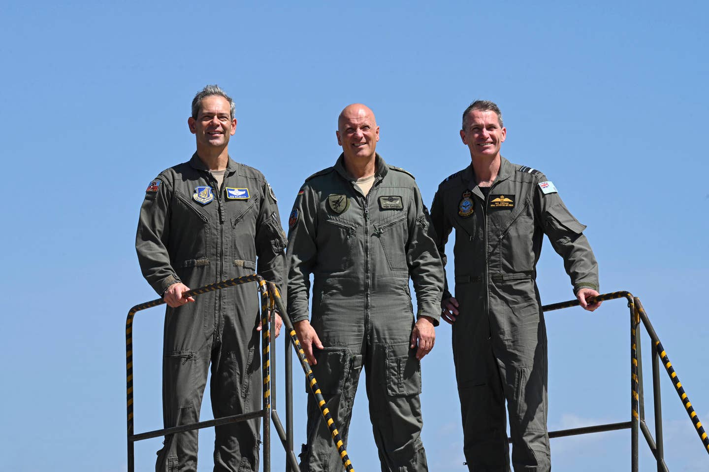 U.S. Air Force Gen. Ken Wilsbach, left, Pacific Air Forces commander, poses for a photo with German Air Force Lt. Gen. Ingo Gerhartz, middle, Chief of Air Force, and Royal Australian Air Force Air Marshal Robert Chipman, right, Chief of Air Force, at RAAF Base Darwin, Australia, in September 2022. <em>U.S. Air Force photo by Staff Sgt. Savannah L. Waters</em>