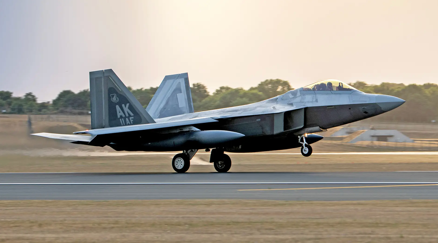 An F-22 assigned to the 90th Fighter Squadron, 3rd Wing, Joint Base Elmendorf-Richardson, Alaska lands at Royal Air Force Lakenheath, England, in July 2022, for a stopover ahead of its rotation to Poland. <em>U.S. Air Force photo by Airman Seleena Muhammad-Ali</em>