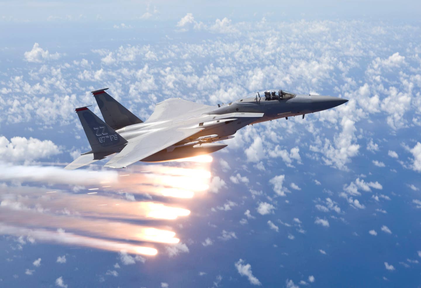 An F-15C from the 67th Fighter Squadron at Kadena Air Base, Okinawa, Japan, releases flares over the Pacific Ocean during a training mission. <em>Getty Images</em>