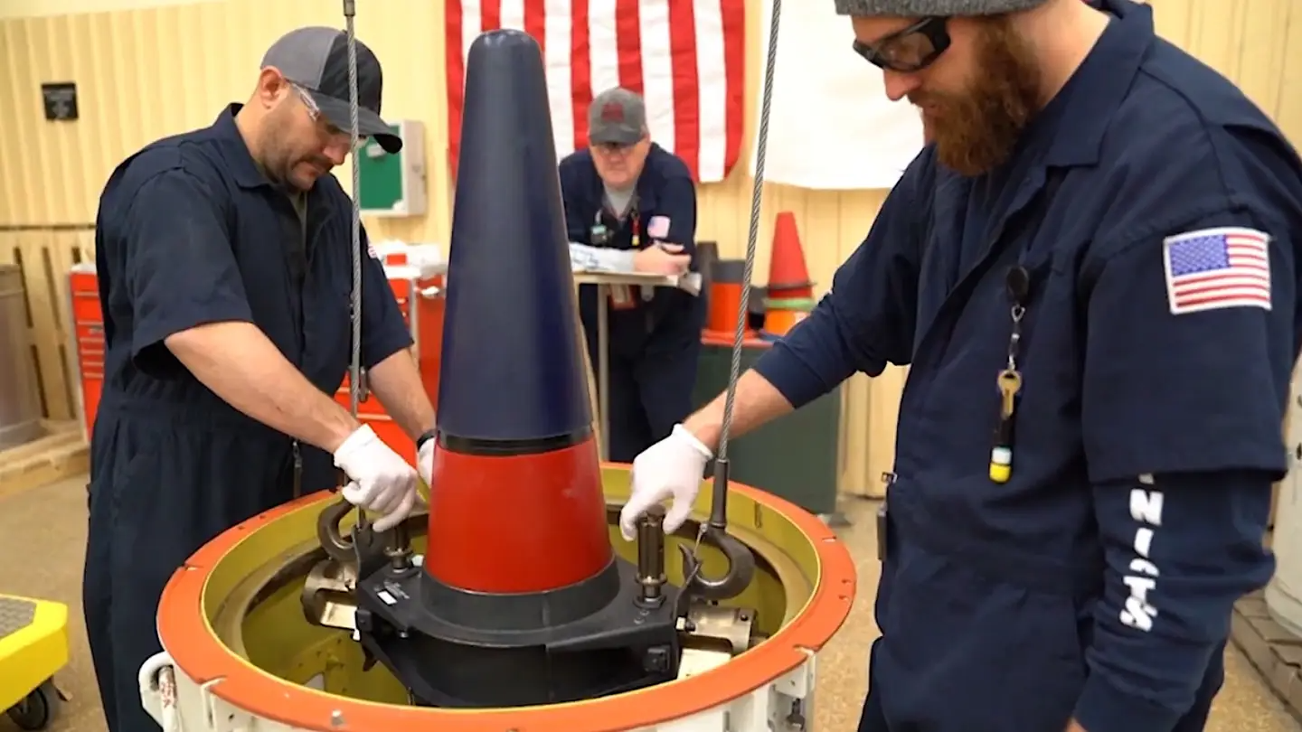 Personnel at the Pantex plant in Texas load a Mk 4A reentry vehicle containing a W76-1 warhead into a container for transport. The W76-2 warhead fits inside the same reentry vehicle. <em>Credit: YouTube screenshot</em>
