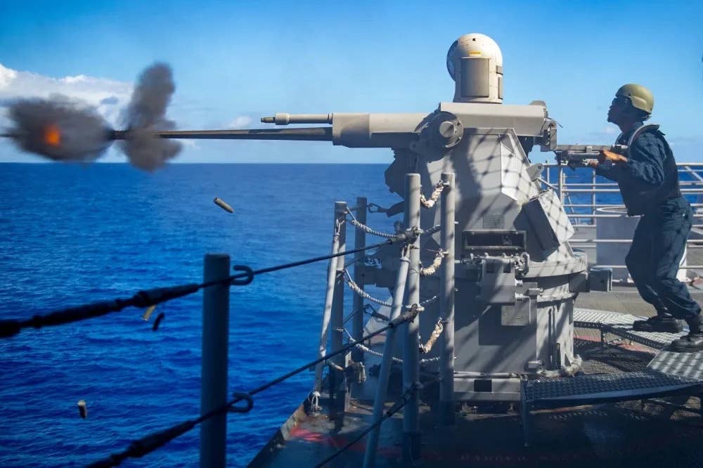 A Mk 38 25mm chain gun-armed weapon system, which can be crew-served or operated remotely, in action. <em>USN</em>