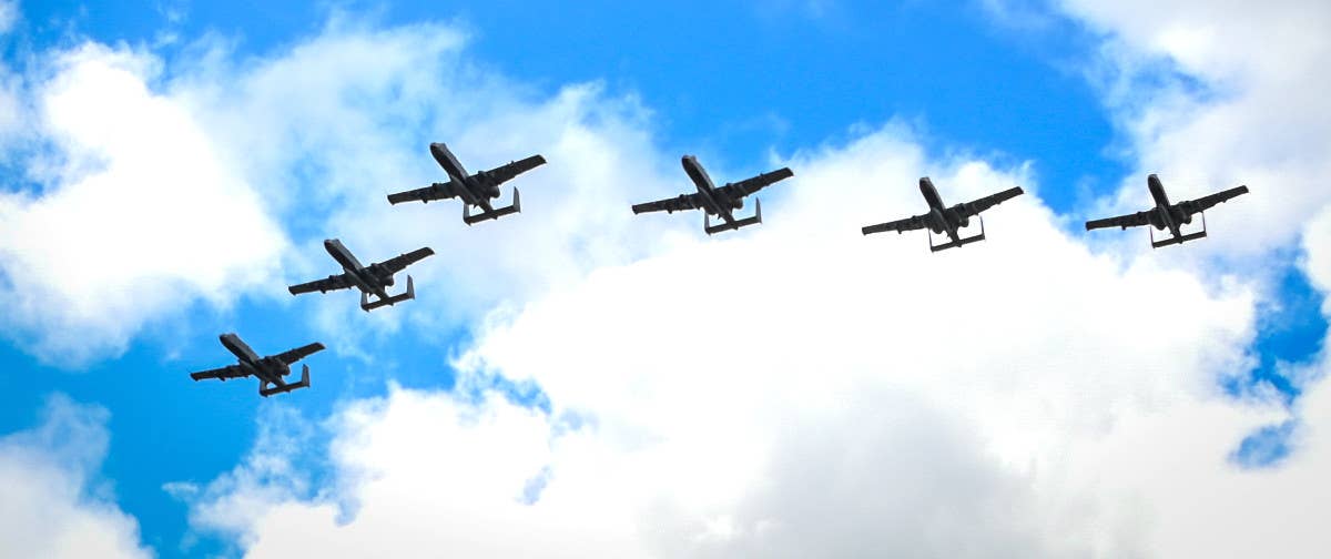 Six of the 23rd Wing's A-10Cs fly over Palau's Roman Tmetuchl International Airport on November 8 as part of Exercise Iron Thunder. <em>USAF</em>