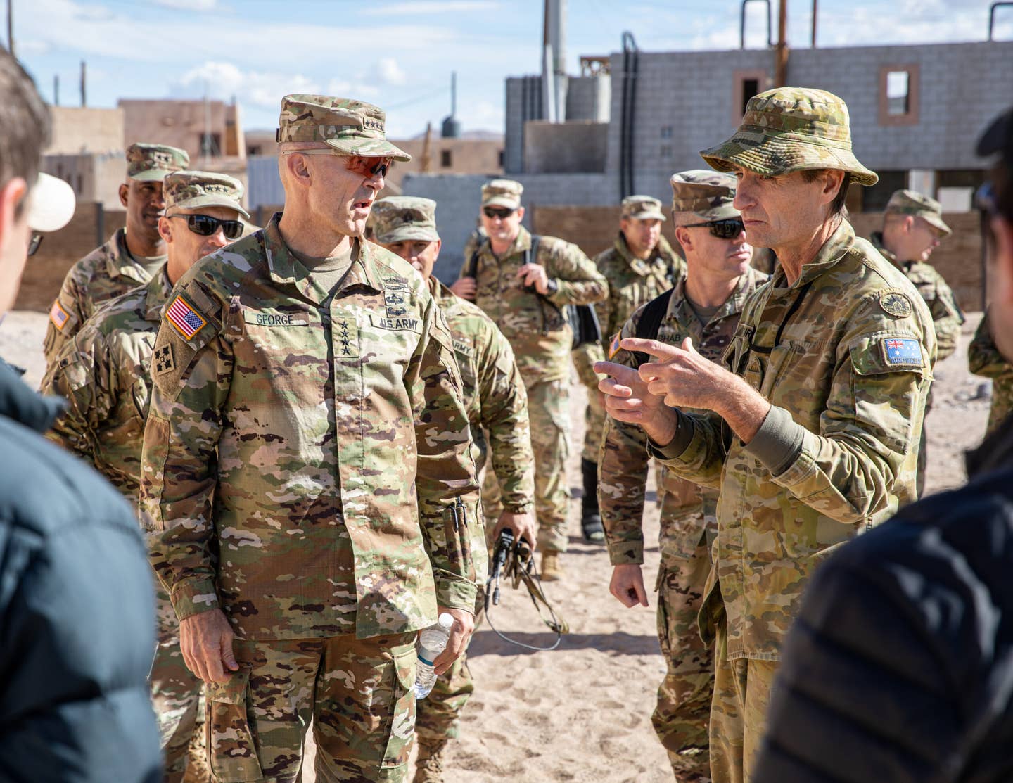 U.S. Army Gen. Randy George, Vice Chief of Staff of the Army, and Australian Lt. Col. Stuart Purves, liaison at Army Futures Command, talk about Project Convergence 2022 Nov. 3, Fort Irwin, California. <em>U.S. Army photo by Staff Sgt. Matthew Lumagui</em>
