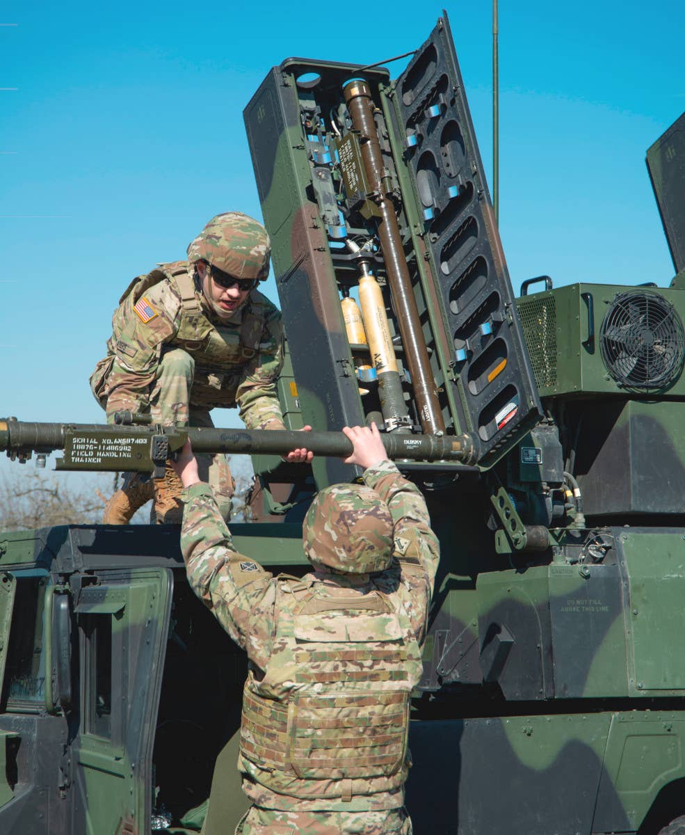 US Army soldiers load training versions of the Stinger missile into an Avenger system. <em>US Army</em>