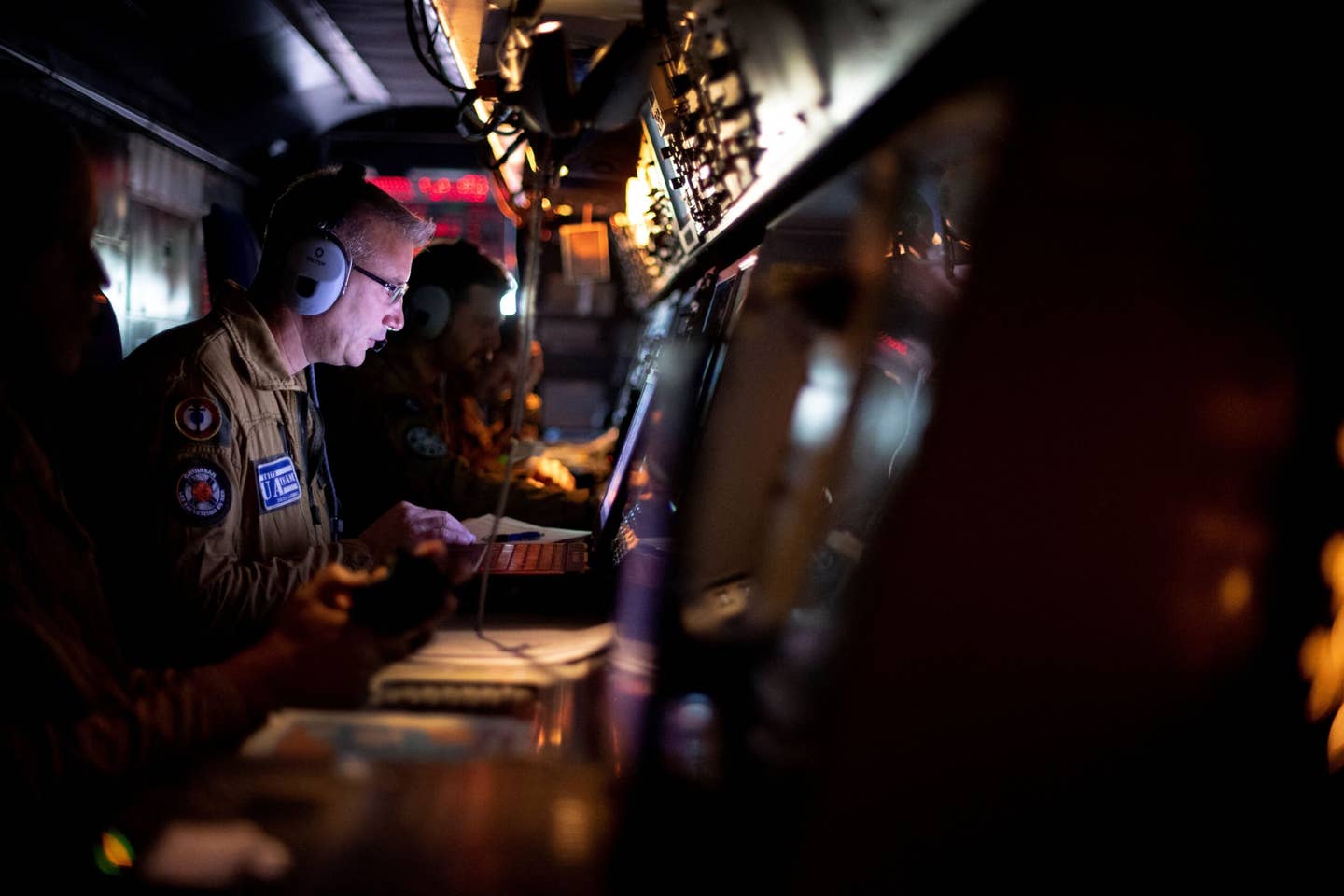 A tactical operator works on board a French Navy Atlantique 2. <em>Photo by FRED TANNEAU/AFP via Getty Images</em>