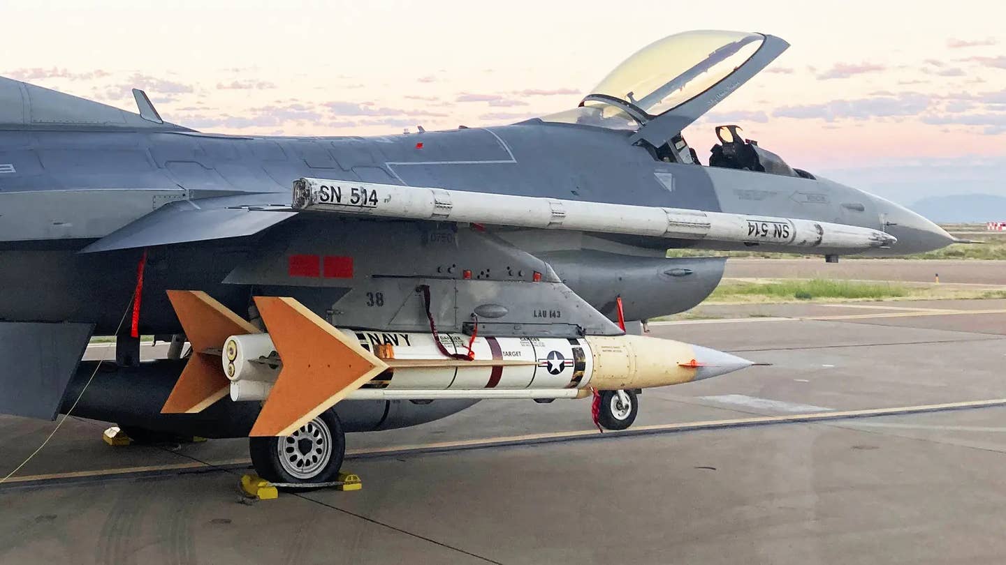 An AQM-37 target drone, seen here under the wing of a US Air Force F-16 fighter jet. The Navy expended its last two AQM-37s and converted AQM-88As will help fill the resulting gap. <em>USN</em>