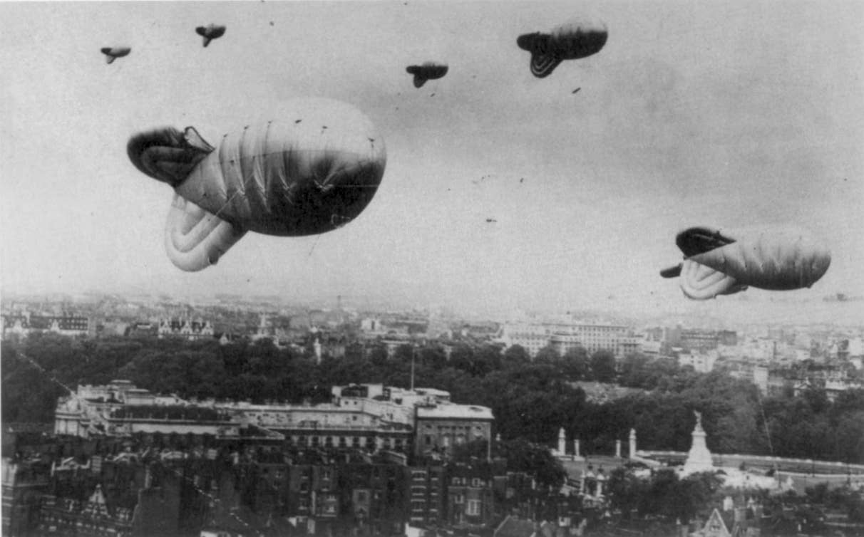 Barrage balloons over London during World War II. Buckingham Palace and the Victoria Memorial can be seen in the middle ground. (Credit: Unknown author/Wikimedia Commons)
